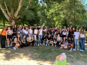 A group of people posing for a photo in a park.