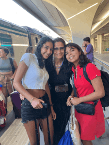 Three women posing for a picture.