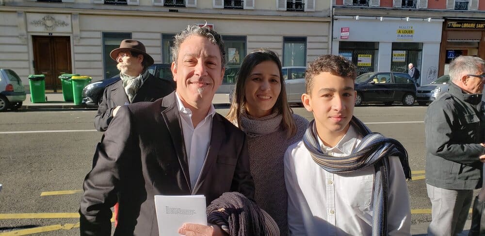 Family portrait in front of a building.