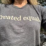 Gray t-shirt with "Created Equal" text.