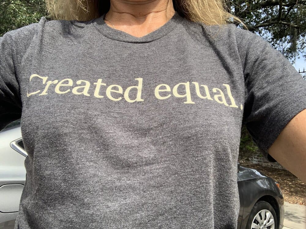 Gray t-shirt with "Created Equal" text.