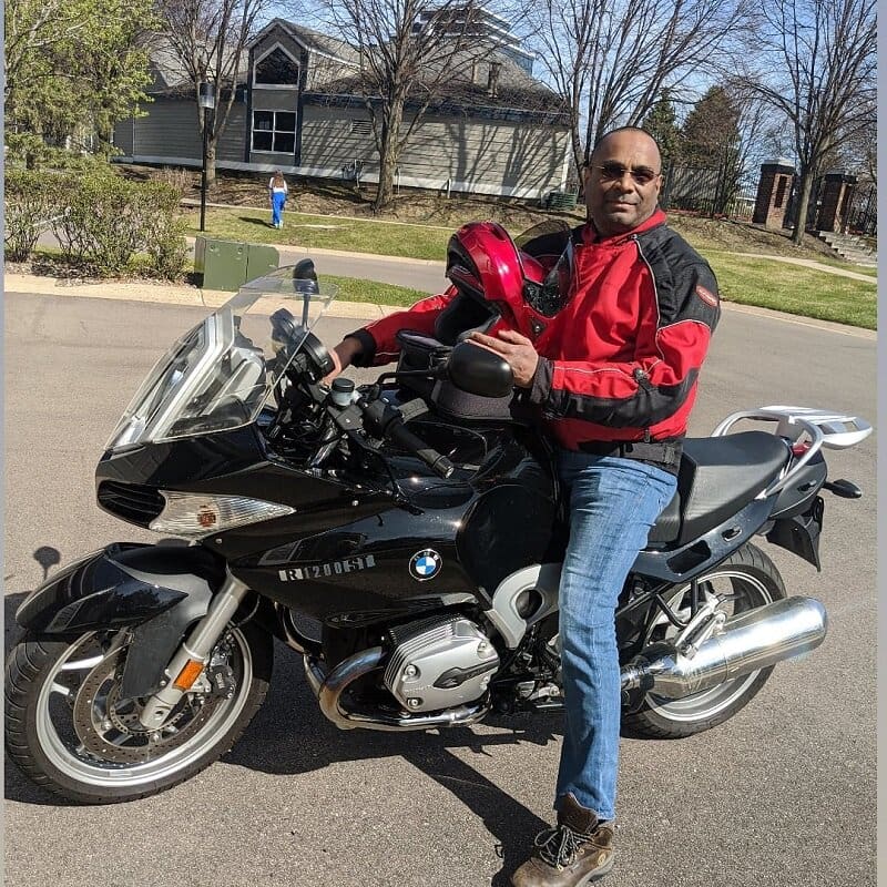 Man on a black BMW motorcycle.