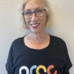 Woman wearing a black shirt with "ARCC" logo.