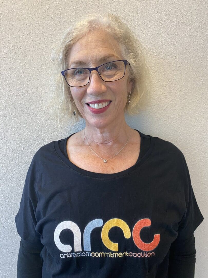 Woman wearing a black shirt with "ARCC" logo.