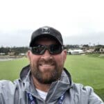 Man smiling at the US Open 2019.