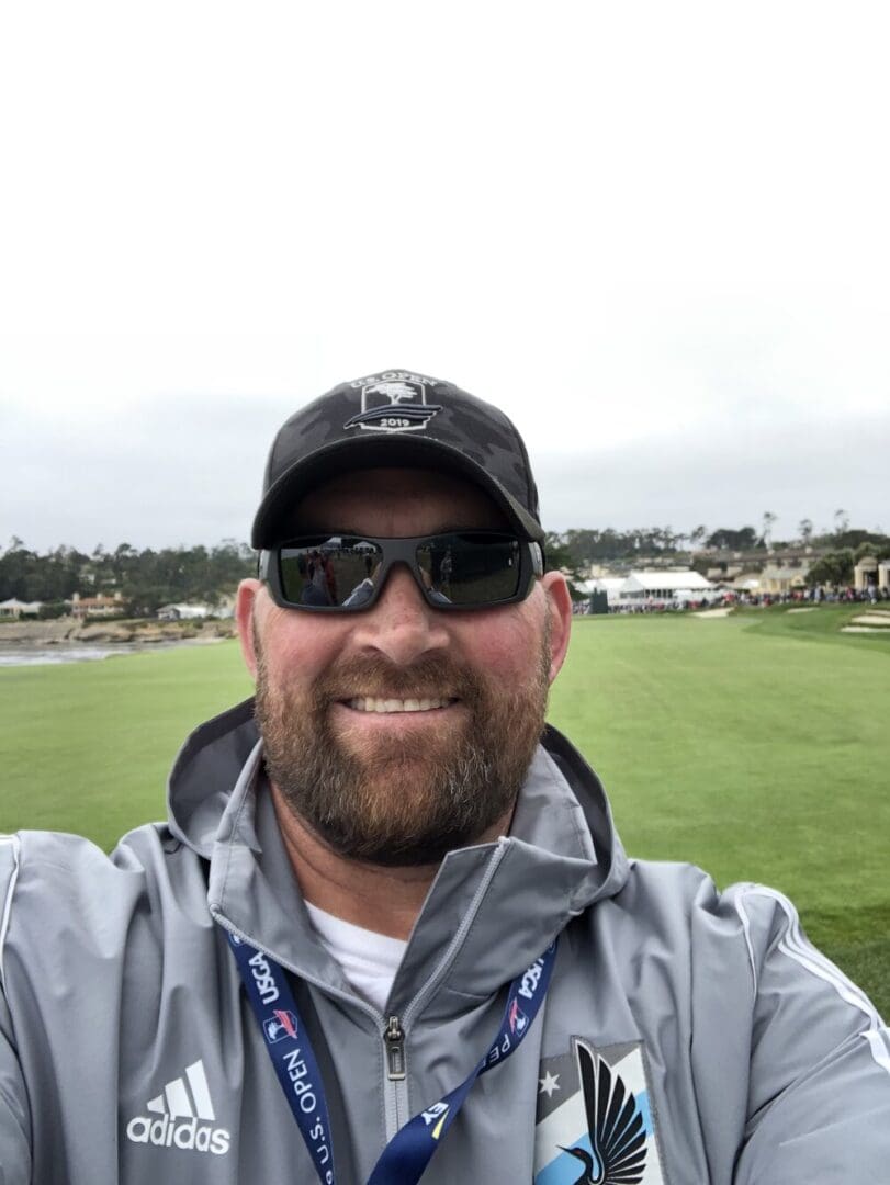 Man smiling at the US Open 2019.