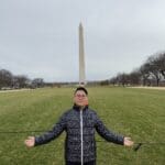 Man in front of Washington Monument.