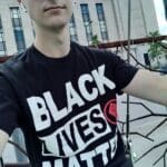 Man wearing a Black Lives Matter shirt.