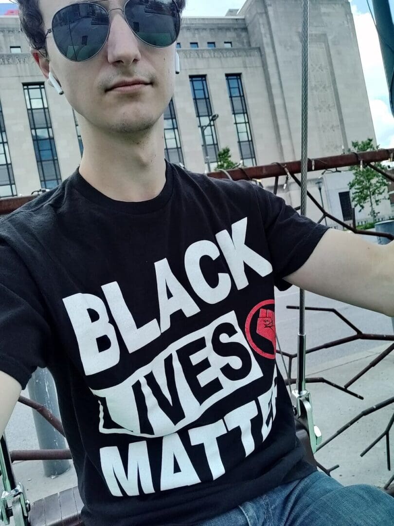 Man wearing a Black Lives Matter shirt.