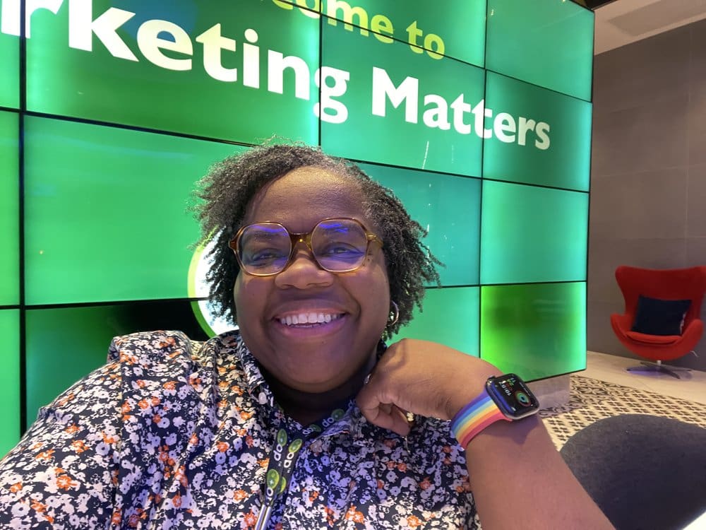 Smiling woman in glasses at Marketing Matters event.