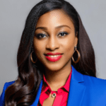 Headshot of a woman in a blue blazer.